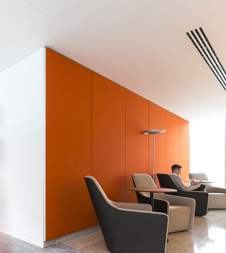Photograph of an orange wall in an office building