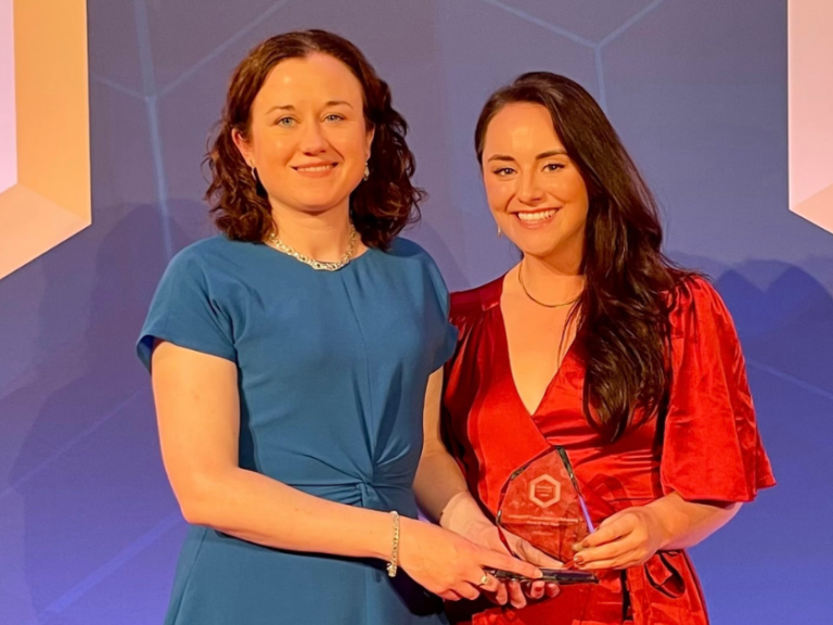 Olivia Mullooly and Alison Peate pictured with the award on front of the Managing IP photowall at the awards ceremony.