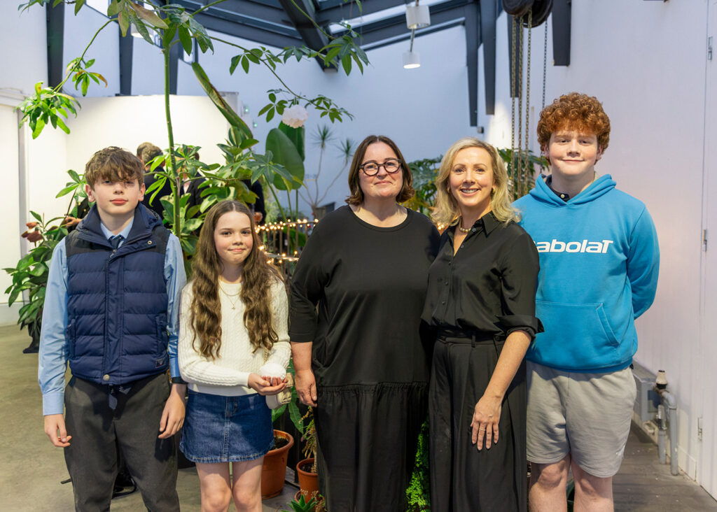 Pictured is Joanne with Ita, Paul Robinson’s wife, and their family.