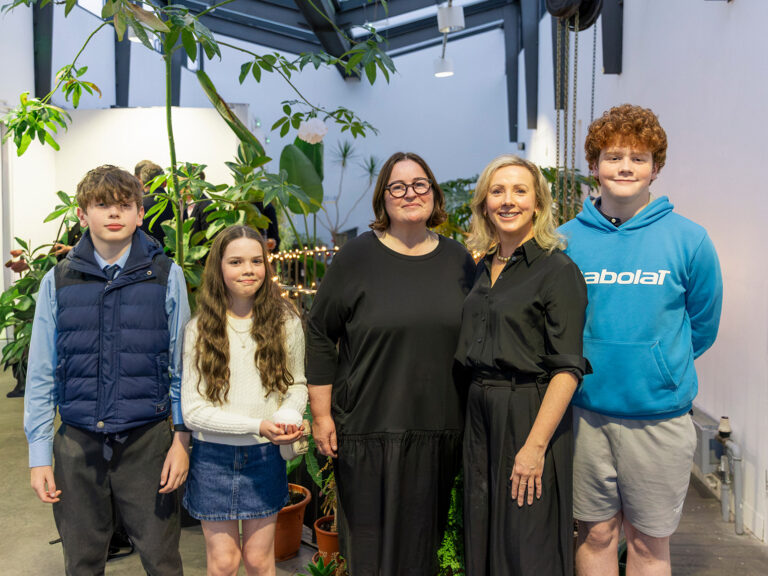Pictured is Joanne with Ita, Paul Robinson’s wife, and their family.